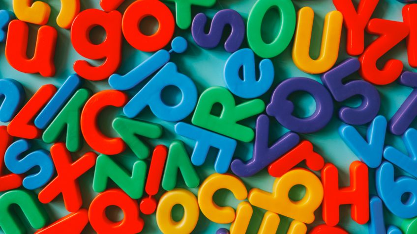 Vocabulary is built from colorful alphabet letters.